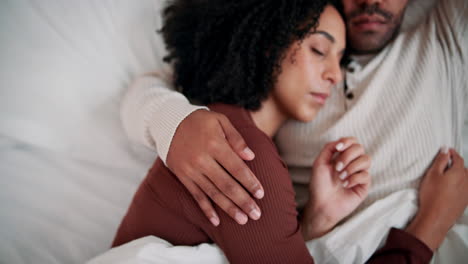 couple cuddling in bed
