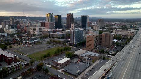 aerial pullout over freeway and rush hour birmingham alabama skyline captured in 5k