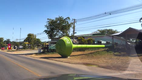 colorful tanks displayed along a rural road