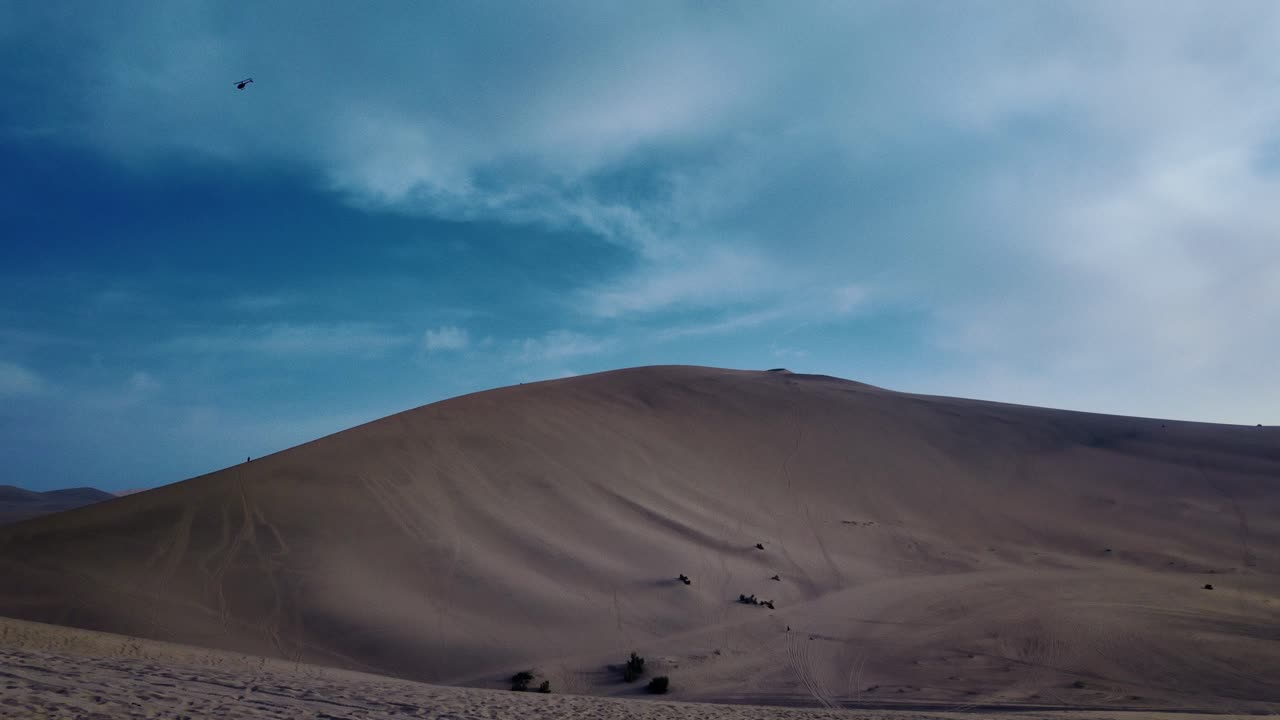 Atmospheric View Of The Mingsha Shan - Echoing Sand Mountain Near Dunhuang In Gansu Province, China. Panning Shot