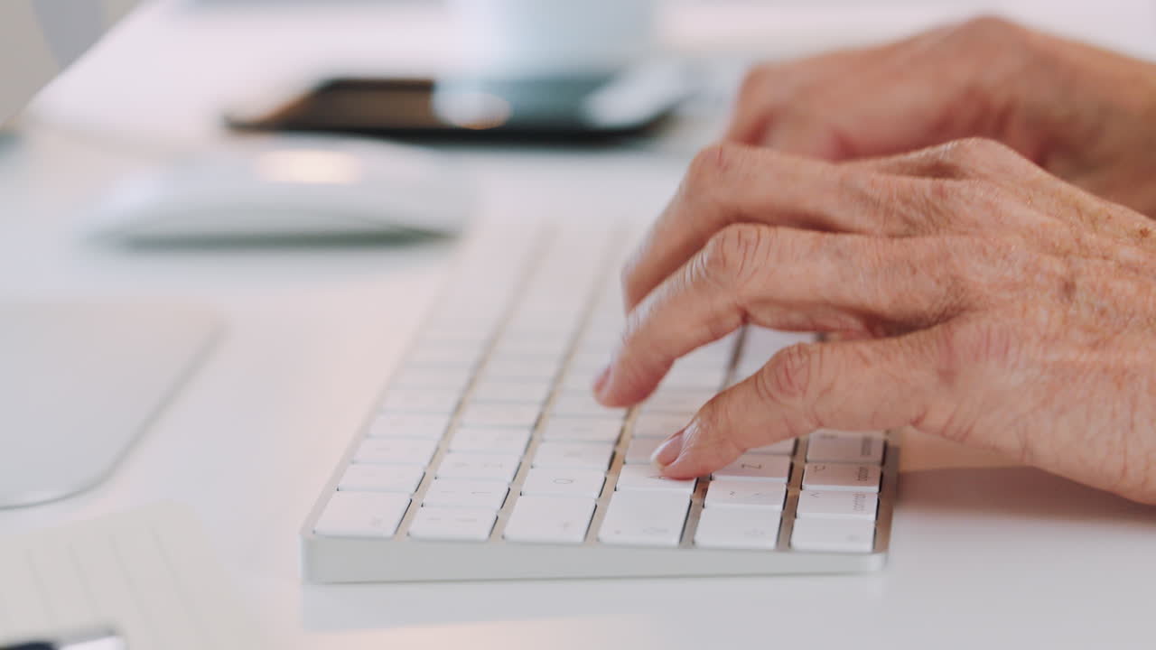 Hands, phone and typing on keyboard in office