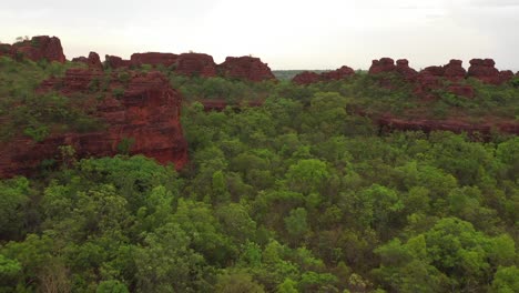 an-aerial-shot-of-the-red-mountain-during-midday