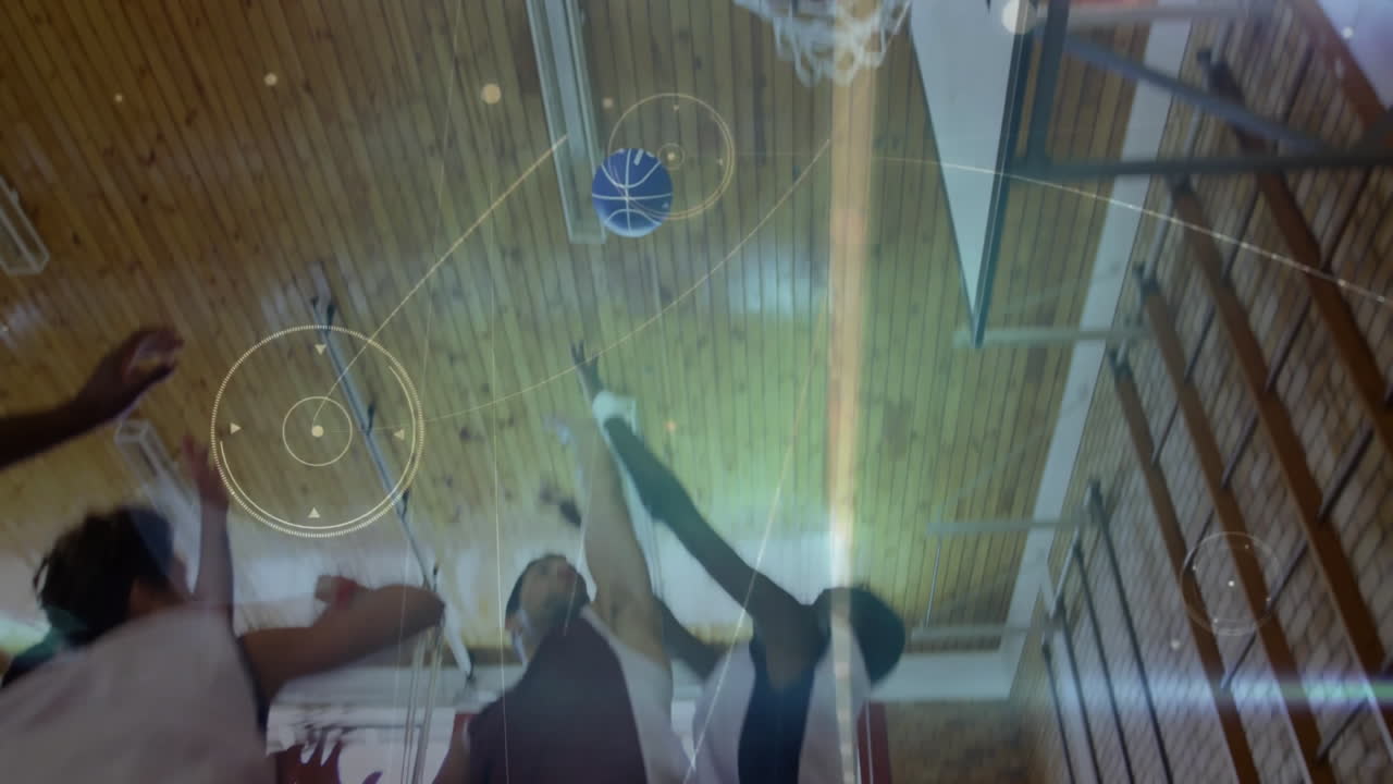 Basketball going through hoop with animation effects in school gym