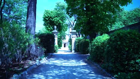 beautiful garden, park path with lots of greenery in good weather in france vincent van gogh house