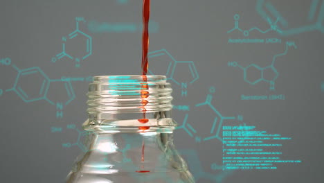 liquid pouring into bottle with data and structural formula of chemical compounds in the foregr