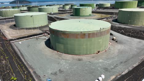 Drone-shot-flying-over-oil-refinery-storage-in-Anacortes,-WA