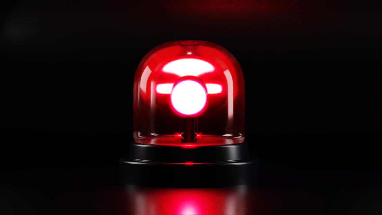 Roterend rood zwaailicht knipperend in het donker