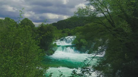 natural majestic waterfall at krka national park in croatia with its exceptional lush green natural beauty in spring time. cinemagraph / seamless video loop of the famous tourist vacation and filming location of the writer karl may western winnetou movies