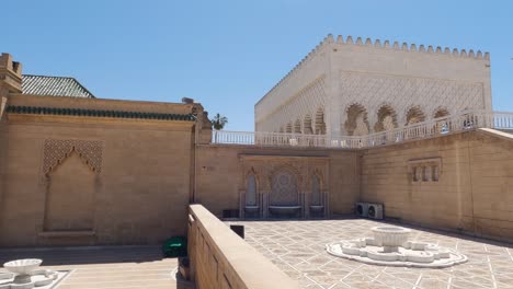 Pov-wide-shot-of-facade-of-Mausoleum-Mohammed-V-in-Rabat,-Morocco