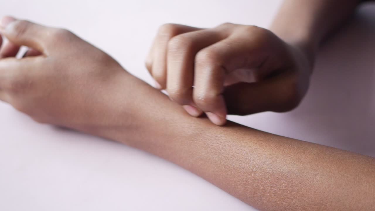 Person scratching their arm