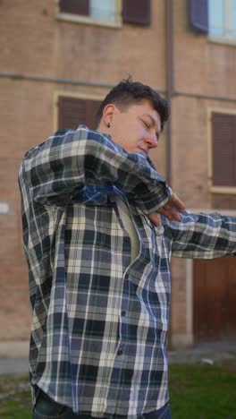 man posing in a plaid shirt