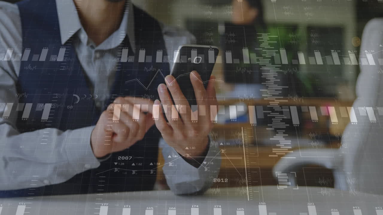 Man tapping smartphone in modern business office, displaying floating data charts and graphs