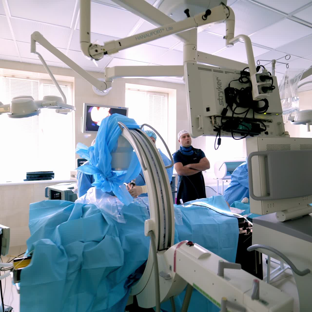 Process of trauma surgery operation. Group of surgeons in operating room with surgery equipment.
