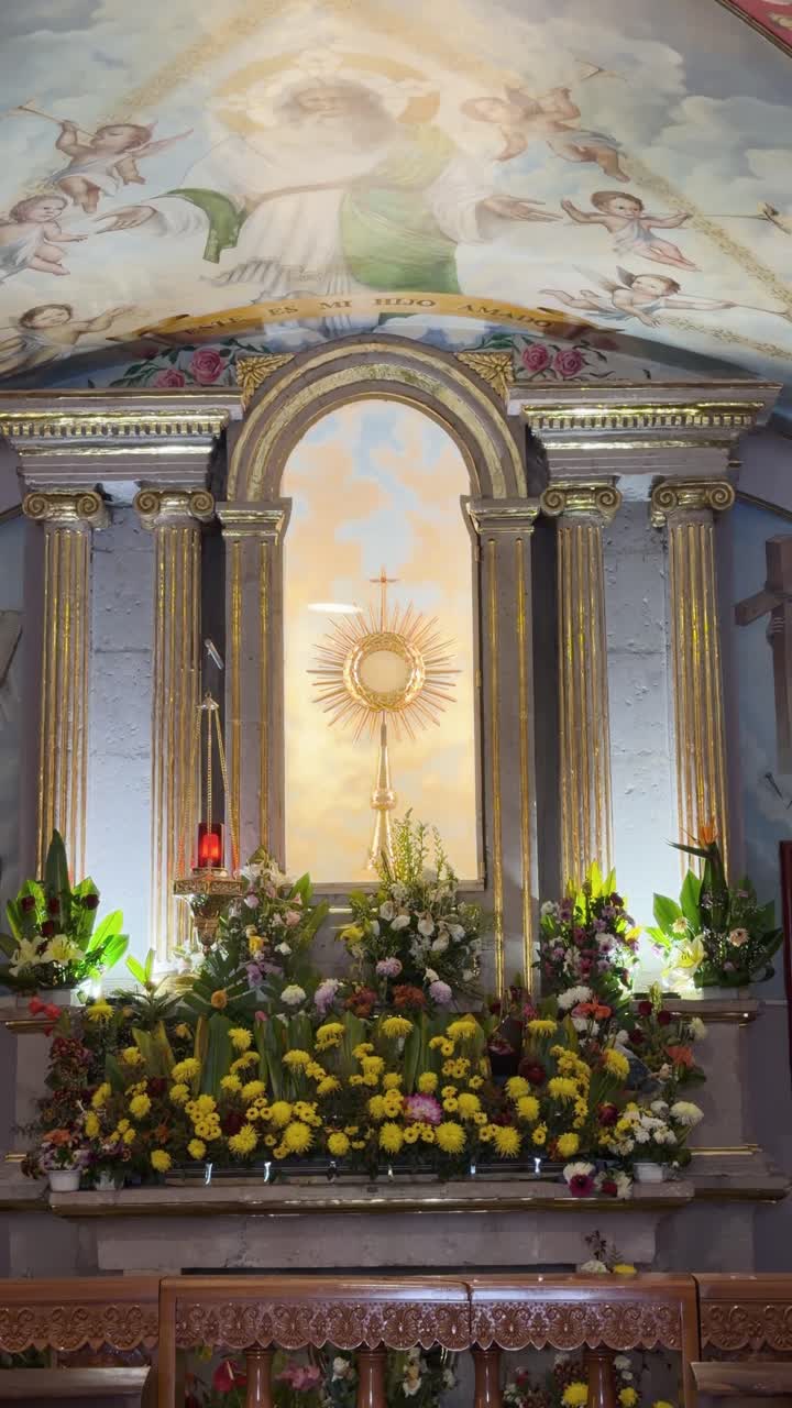 Church interior with altar and flowers, Santuario de Guadalupe in Morelia