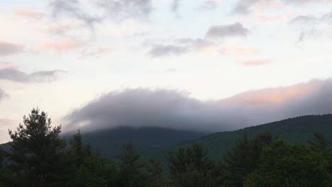 timelapse of weather over green mountains in new england