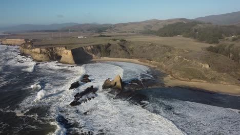 Drone-Camera-Pan-Tilting-upwards-showing-Martin's-Beach