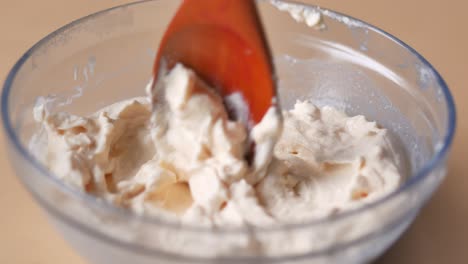 Top-view-of-milk-cream-in-a-container-on-table