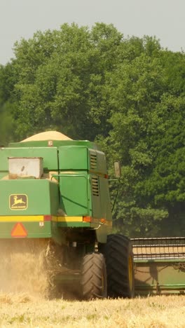 modern combine harvesting grain in the field