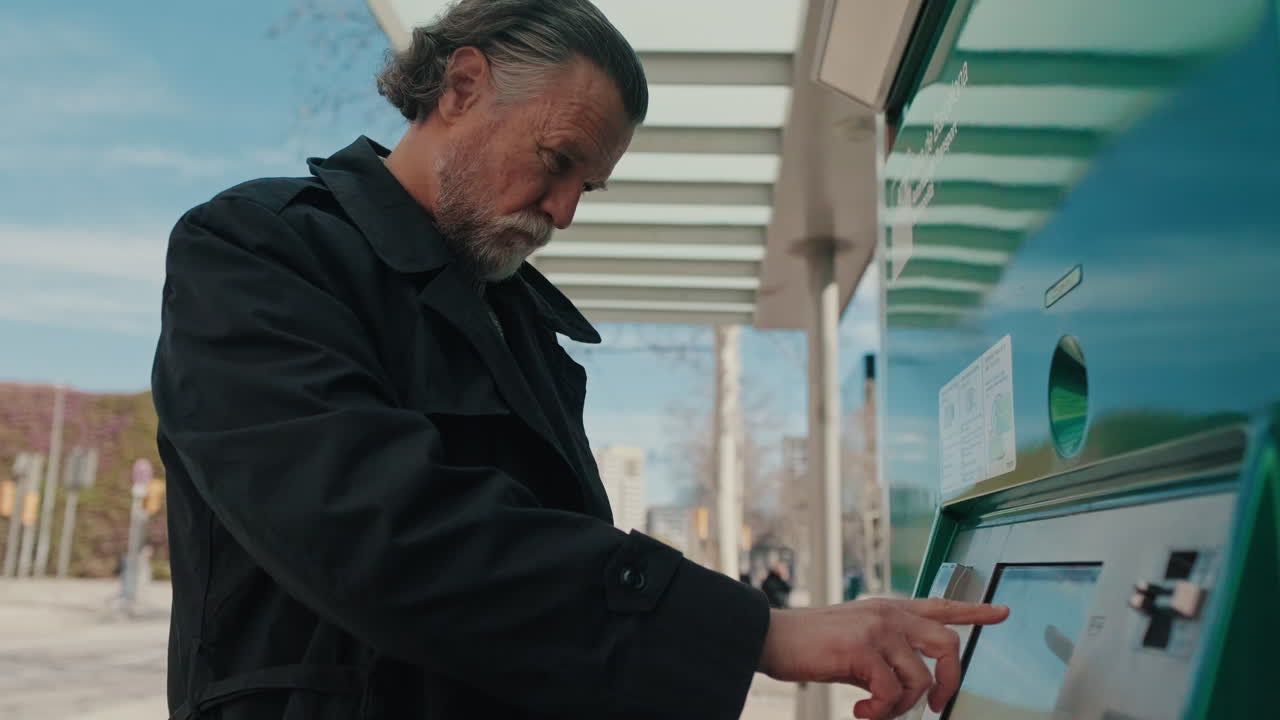 Man Buys Ticket at Public Transport Machine