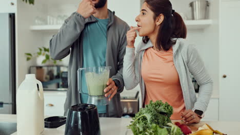 couple making a healthy smoothie in the kitchen