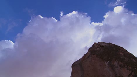 time lapse of clouds and sun rays over strange towering dwellings and rock formations at cappadocia turkey 1