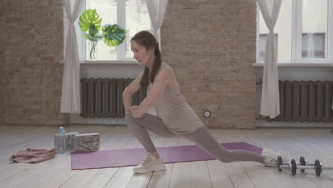 old woman doing exercises at home