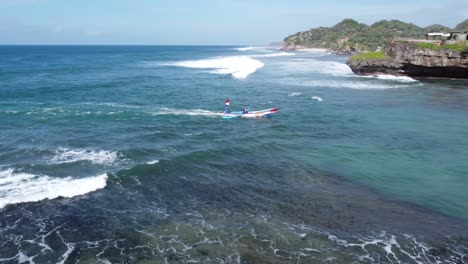 drone shot of the arrival of fishermen on the beach