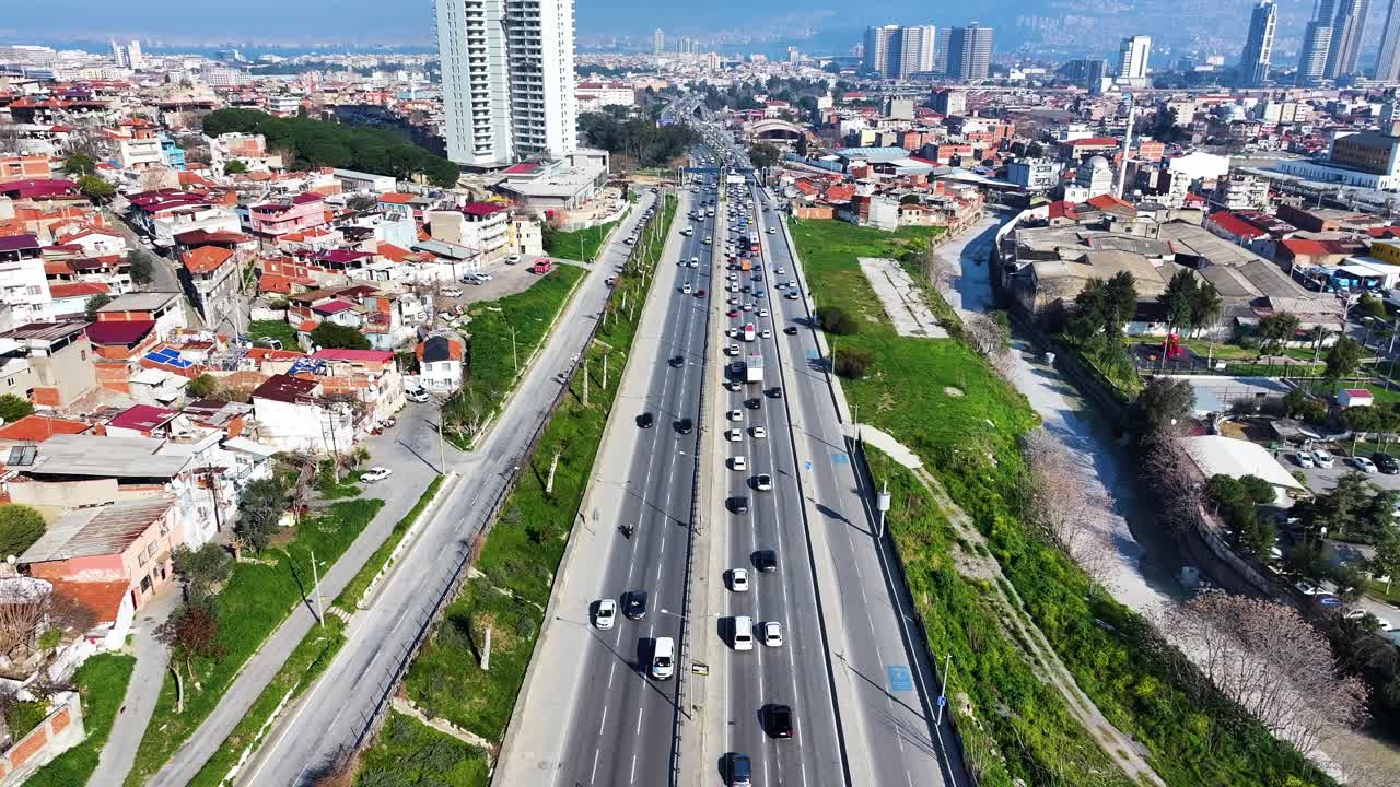 vehicles driving on the street, drone footage of cars in traffic