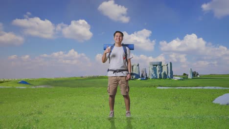 smiling tourist with backpack in a field near ancient stones