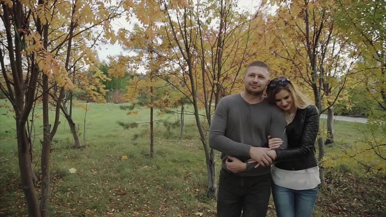 Couple Walking in an Autumn Park