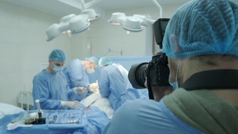 breast augmentation under the guidance surgeons team in surgical operating room