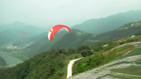 paragliding against mountains