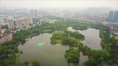 foggy day wuhan cityscape lake aerial panorama 4k tilt shift china