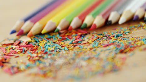 colored pencils arranged in diagonal line with pencil shavings