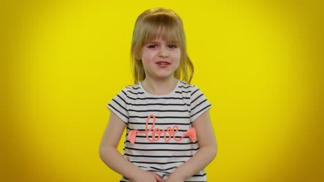 little girl in a striped shirt with love on it