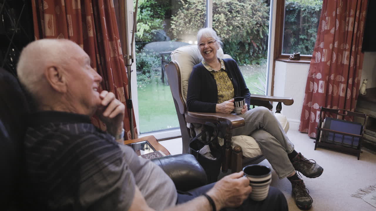 Elderly Couple Enjoying Coffee and Conversation at Home