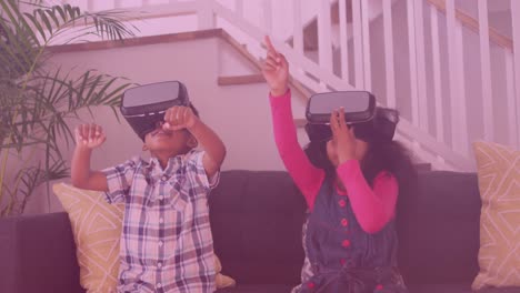 Animation-of-smiling-african-american-siblings-using-vr-headsets