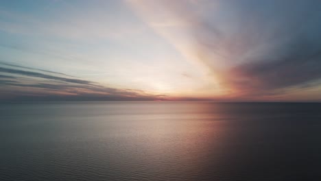 Beautiful-Aerial-Establishing-View-of-Baltic-Sea-Coast-on-a-Sunny-Evening-at-Bernati,-Latvia