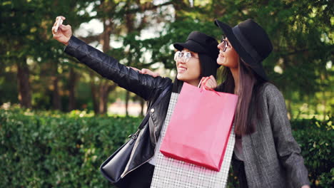 Two Women Taking a Selfie While Shopping