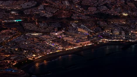 aerial shot capturing night view of luxurious costa adeje in tenerife, spain.