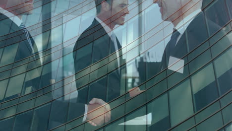 digital composition of two caucasian businessmen shaking hands at office against tall building