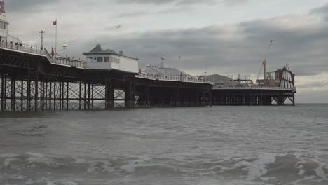 famous brighton city pier on the beach, england uk