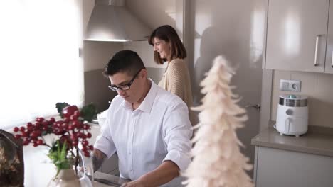 women talking while preparing christmas meal in the kitchen