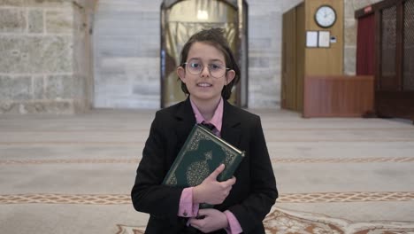 Boy-holding-quran