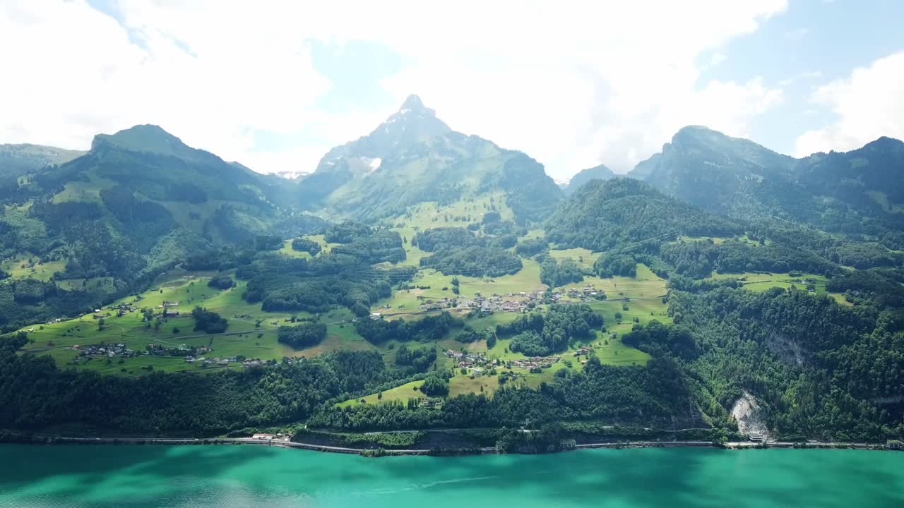 Stunning Aerial View of a Swiss Village Nestled in the Alps