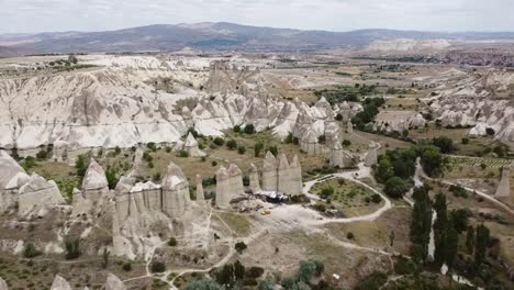 Stunning-aerial-drone-view-of-all-Love-Valley-and-its-Fairy-Chimneys,-unique-landscapes-to-visit-in-Cappadocia,-Turkey