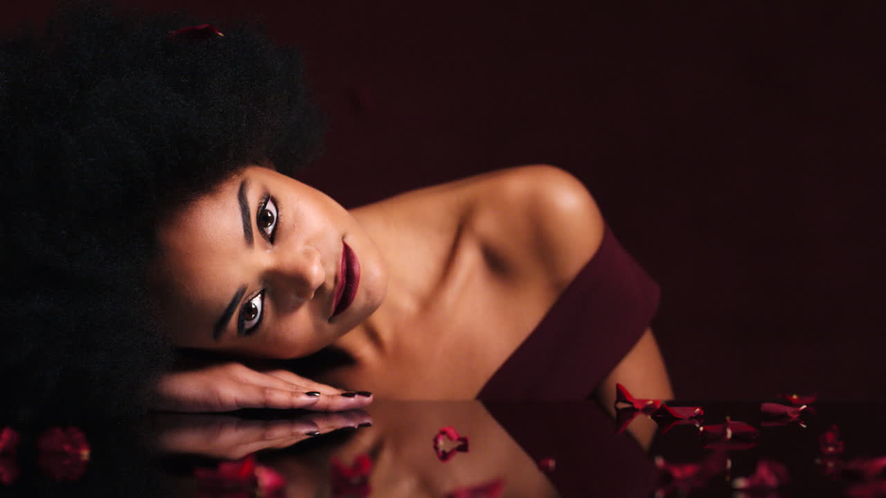 Face, petals and red roses for fashion model