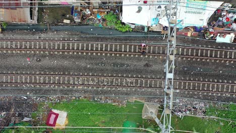 train tracks in a densely populated urban slums