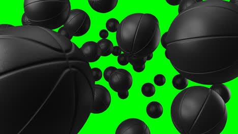 muchas bolas de baloncesto negras en llave de croma verde.