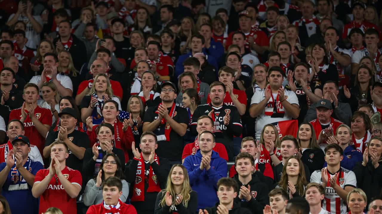 Passionate Fans Unite: A Sea of Enthusiastic Supporters Cheering Together in Unison for Their Team During an Exciting Sporting Event